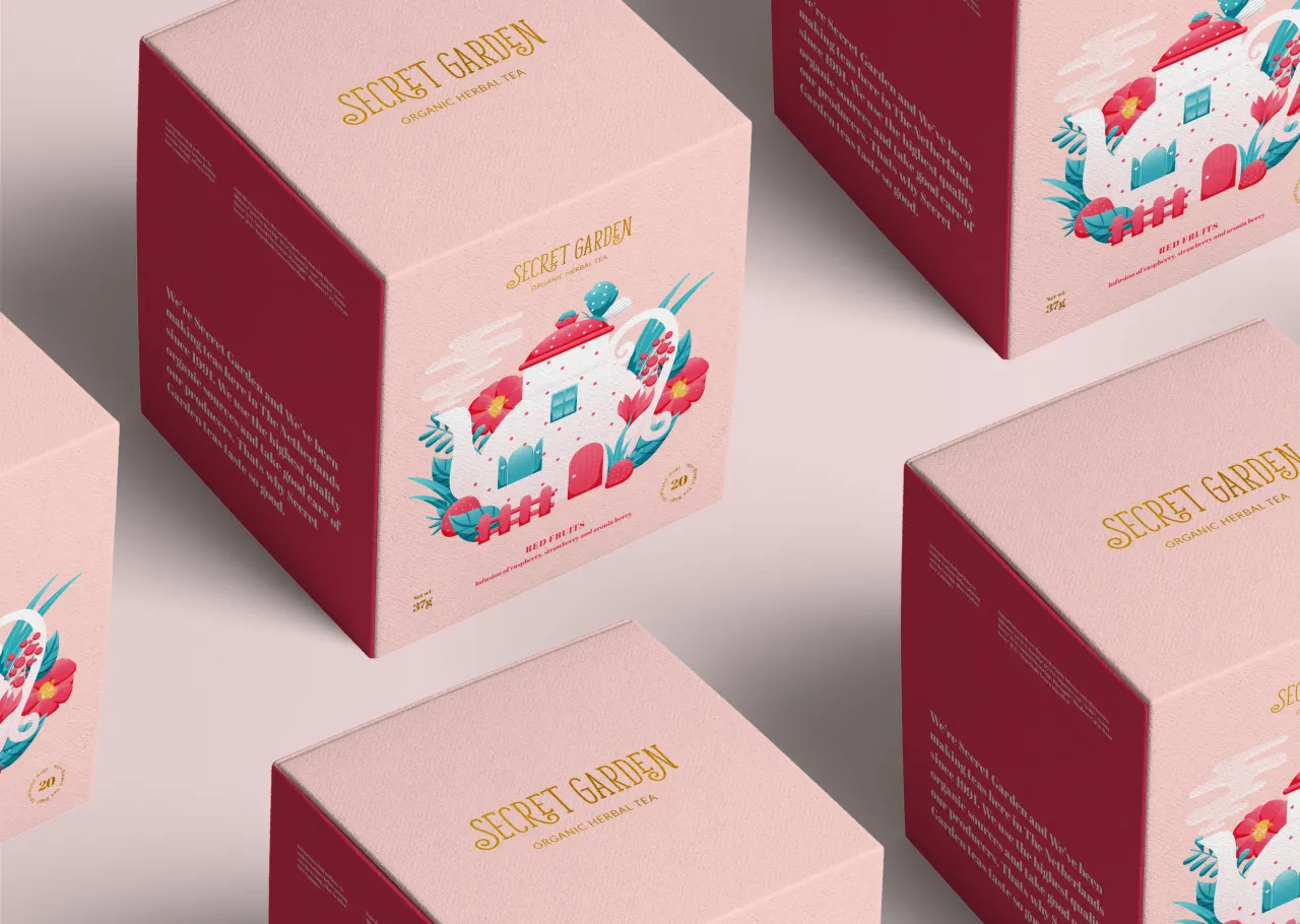 Multiple pink and burgundy Secret Garden tea boxes with gold foil text and colourful teapot illustrations arranged on a pink surface