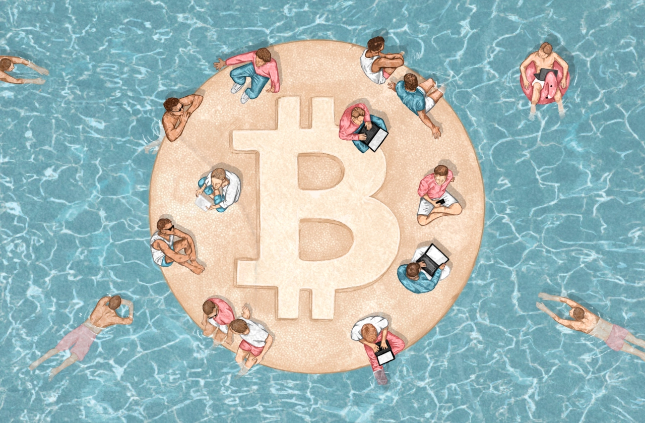 Aerial view of people sunbathing and swimming around a large bitcoin symbol on a circular sand platform in a swimming pool