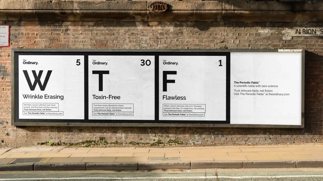 Three panels mounted on a brick wall reading "Wrinkle Erasing", "Toxin-Free" and "Flawless" styled as a periodic table parody by Uncommon advertising agency