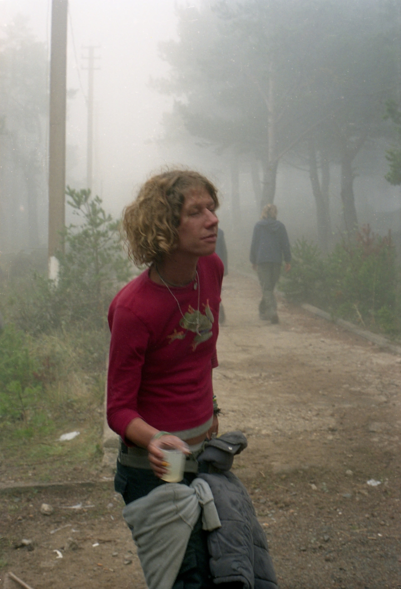 Sacha dancing in the mist, Teknival near Barcelona 2003 © Seana Gavin