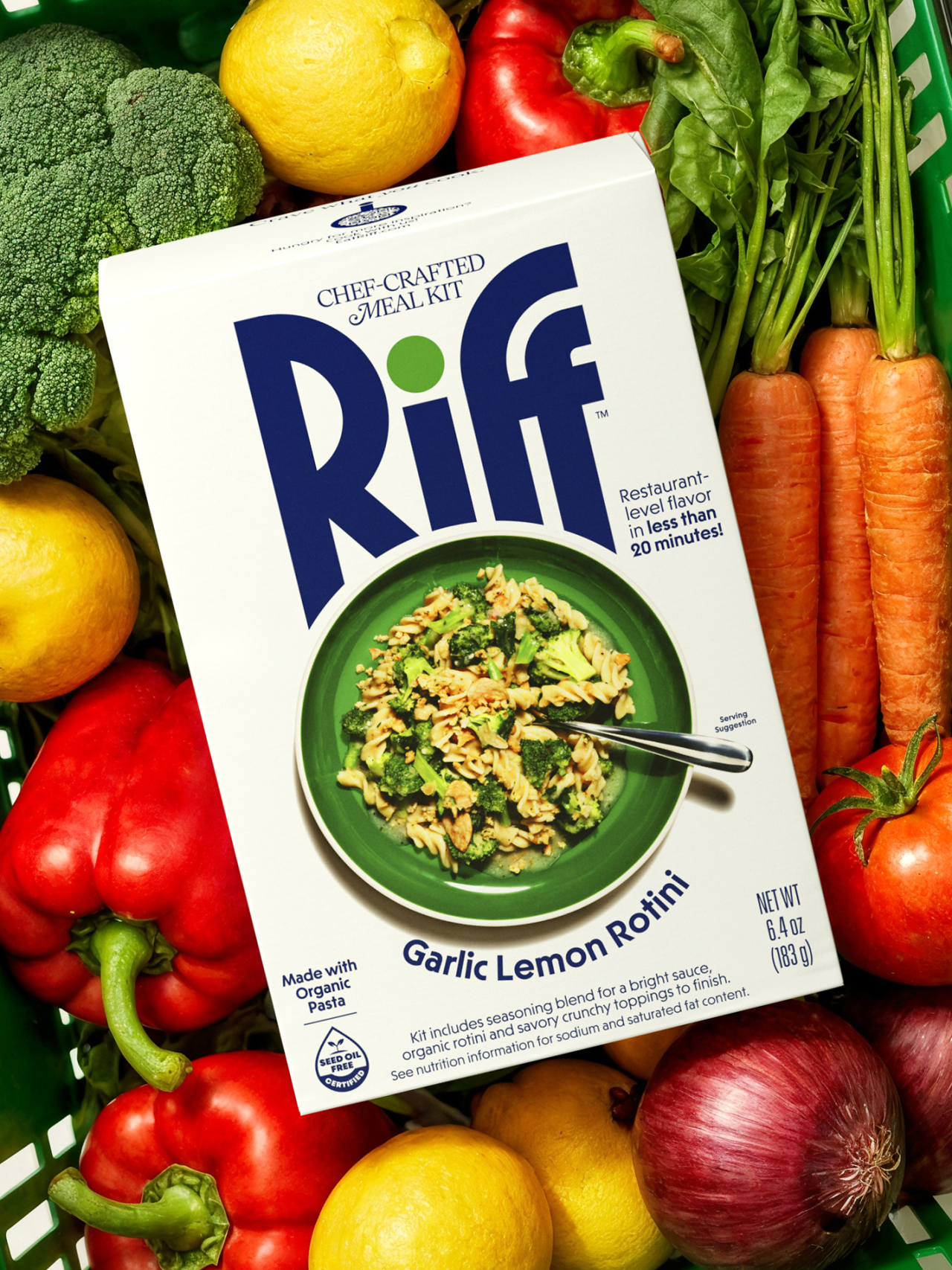 Riff chef-crafted meal kit box for Garlic Lemon Rotini surrounded by fresh vegetables including broccoli, peppers, carrots, lemons and onions