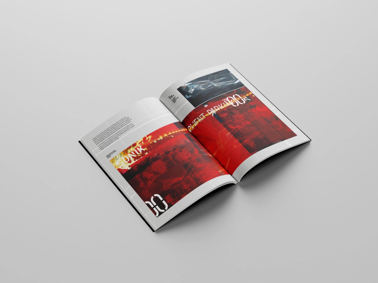 Open magazine spread from Drawing on the Future showing red and dark blue pages with typography and imagery from Perth's rave scene design work