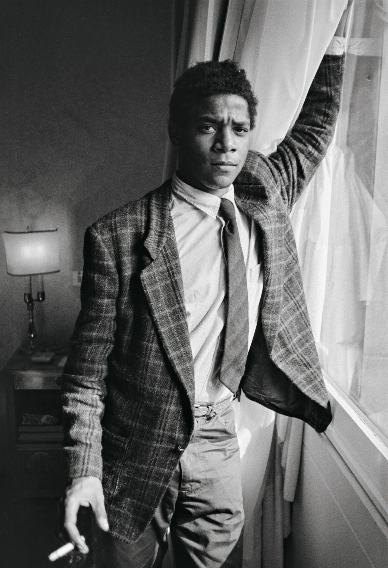 Jean Michel in a Milan hotel room, October 8, 1983. Copyright: © The Andy Warhol Foundation for the Visual Arts, Inc.
