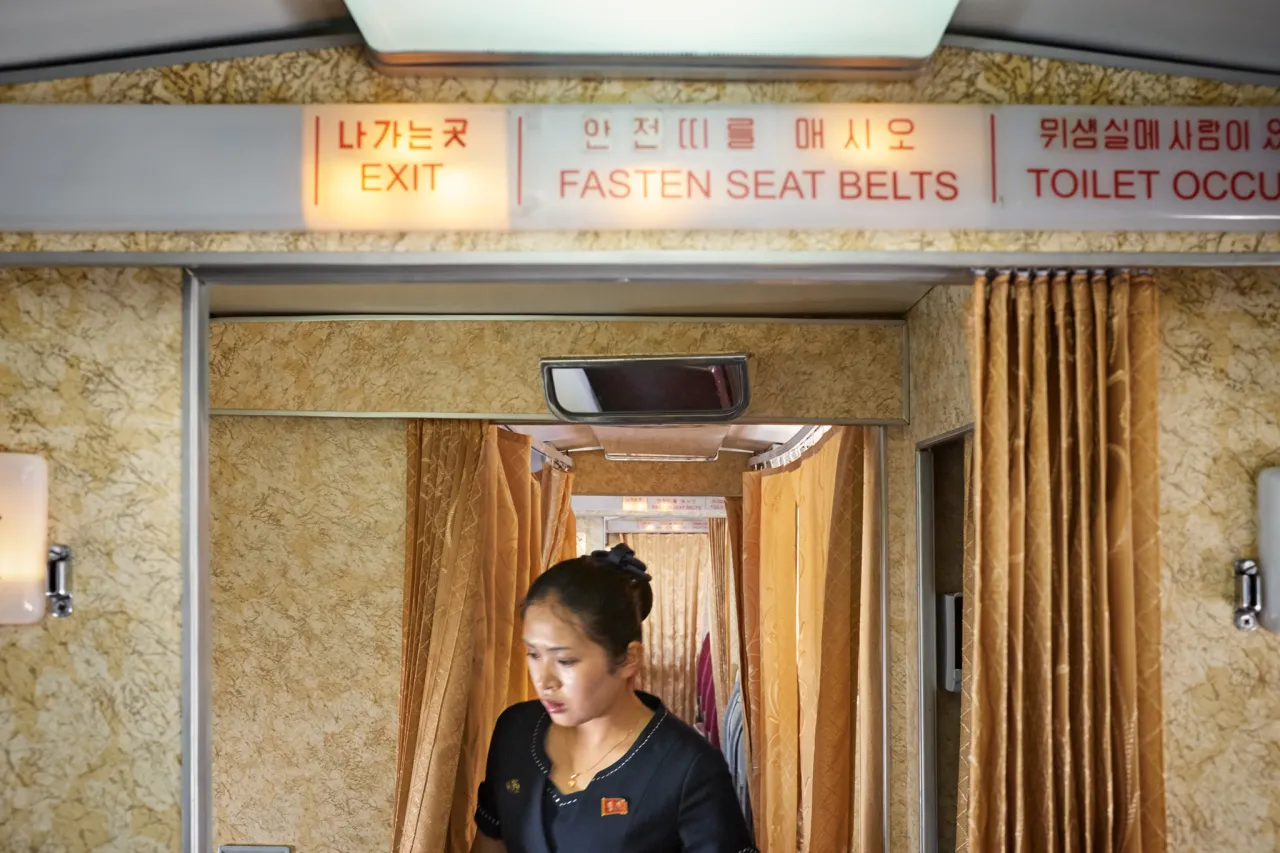 A Stewardess at work in the unique interior of the Tupolev-154