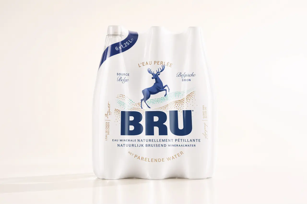 Three bottles of BRU sparkling water with white labels featuring a navy deer logo and typography, displayed against a neutral background
