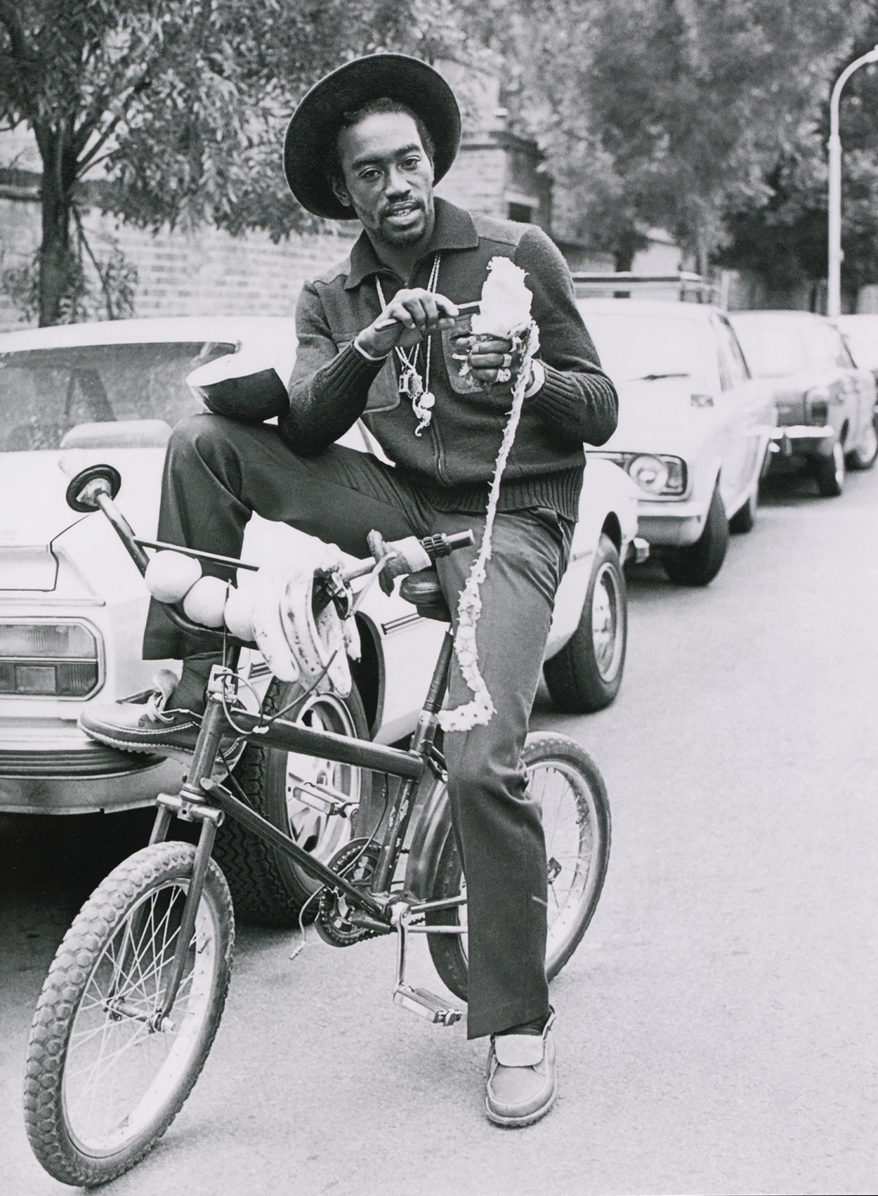 Deejay Ranking Dread wearing Polyveldt Amazons behind the Greensleeves record shop at 44 Uxbridge Road, Shepherds Bush, London, 1981. Photograph © Roger Cracknell