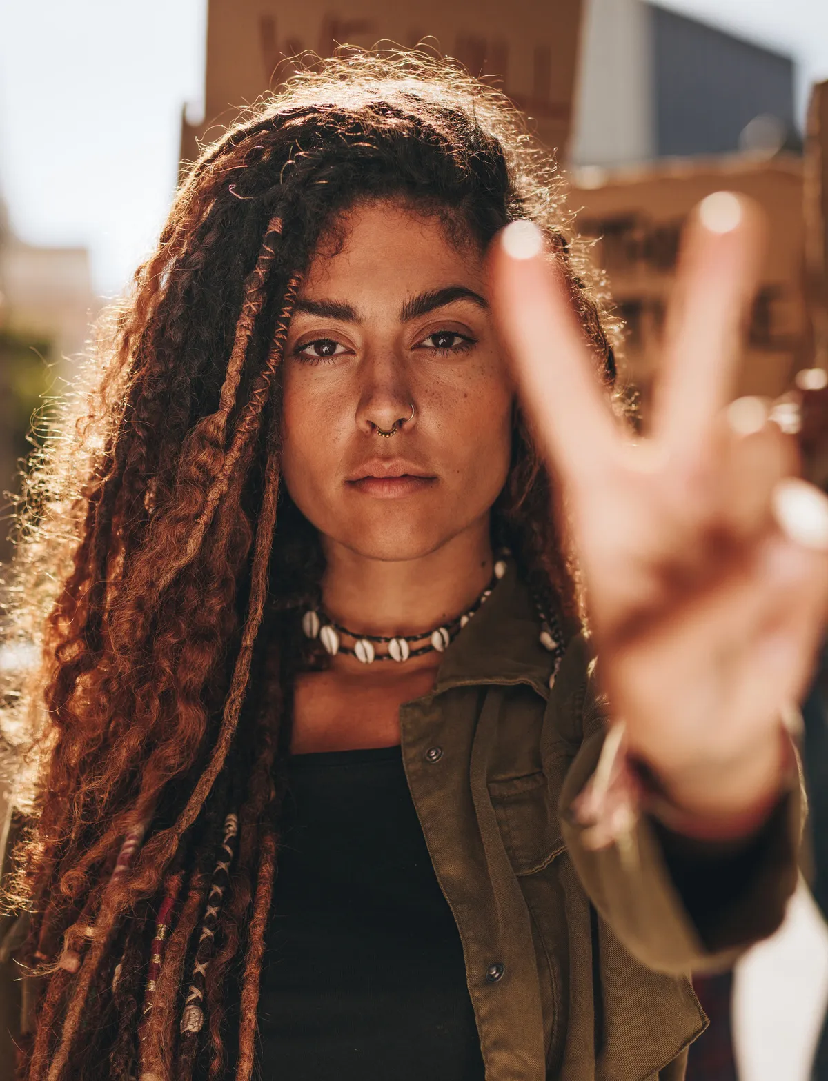 ID: [208427645](https://stock.adobe.com/images/woman-showing-a-peace-sign-during-protest/208427645?prev_url=detail)