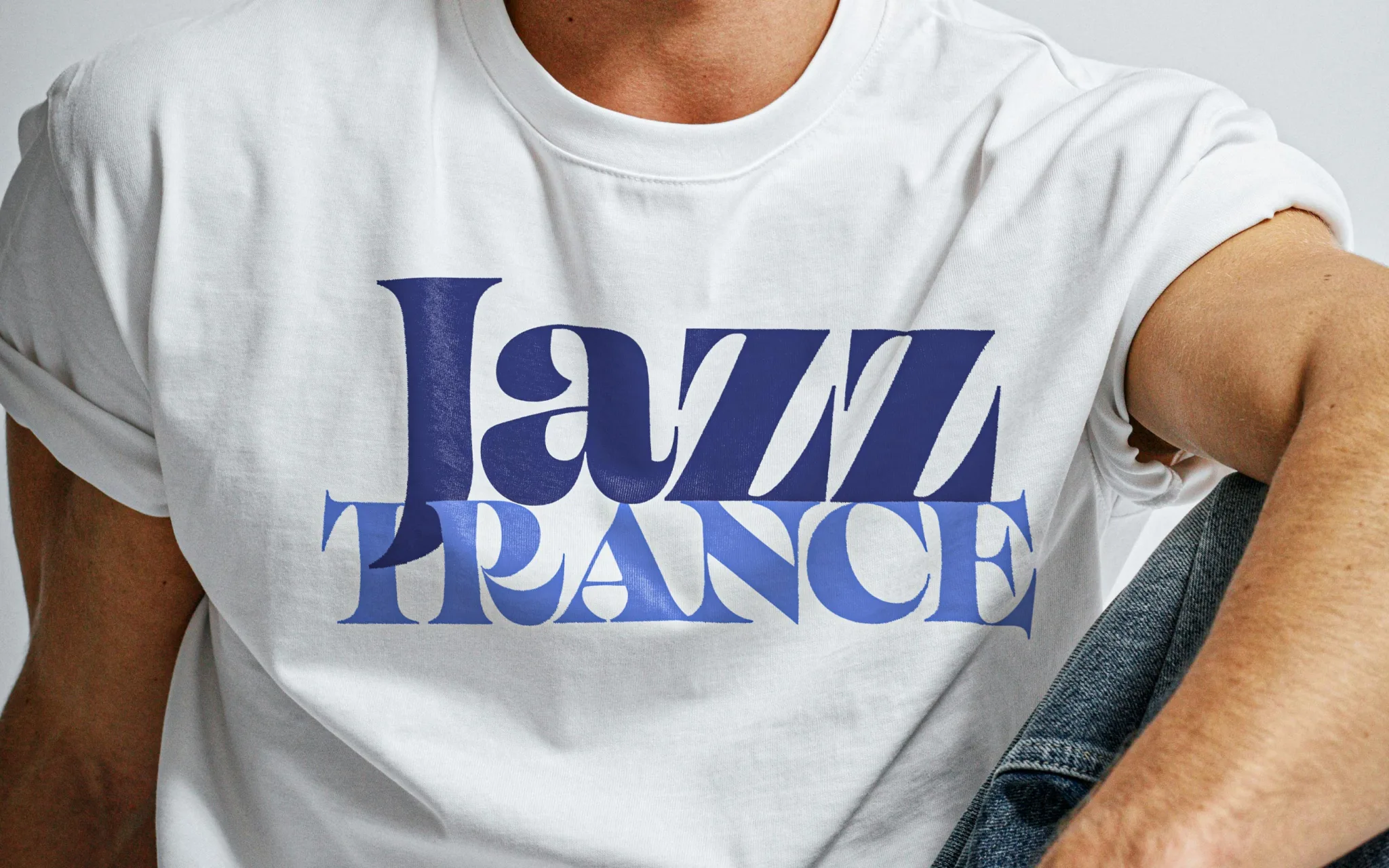 White t-shirt with blue "Jazz France" text design worn by a man