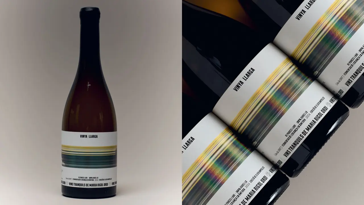Vinya Llarga wine bottle with white label featuring horizontal gold, green and blue streaks that blur like a landscape viewed from a moving train, shown alongside three similar bottles arranged diagonally