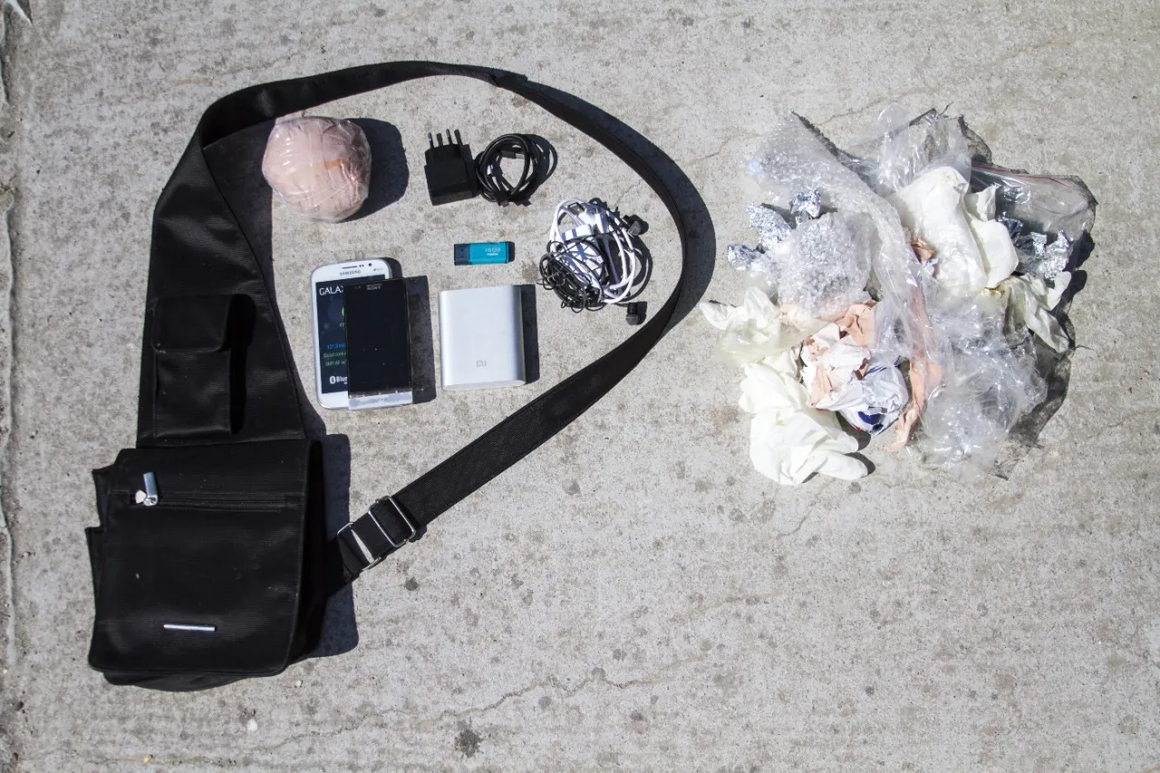 Money, old phone, phone chargers, flash drive