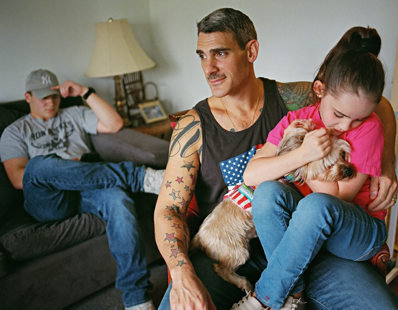 Johnny with his husband and children. Totowa, New Jersey © Bart Heynen from 'Dads' published by powerHouse Books