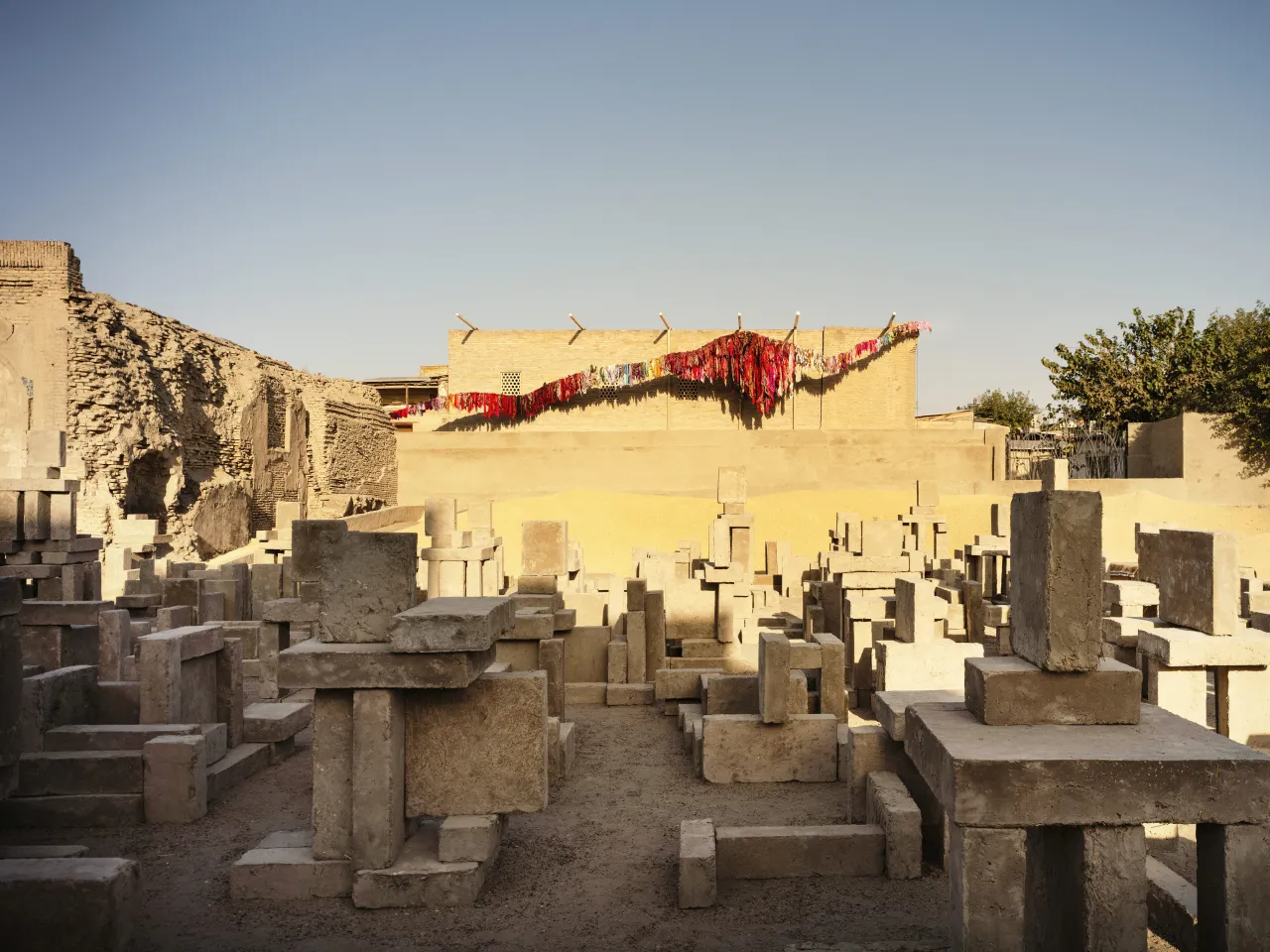 CLOSE, 2024-2025 by Antony Gormley in collaboration with Temur Jumaev, in front of A Thousand Prayers, 2025 by Jazgul Madazimova in collaboration with the women of Bukhara. Photo by Felix Odell courtesy of the Uzbekistan Art and Culture Development Foundation.