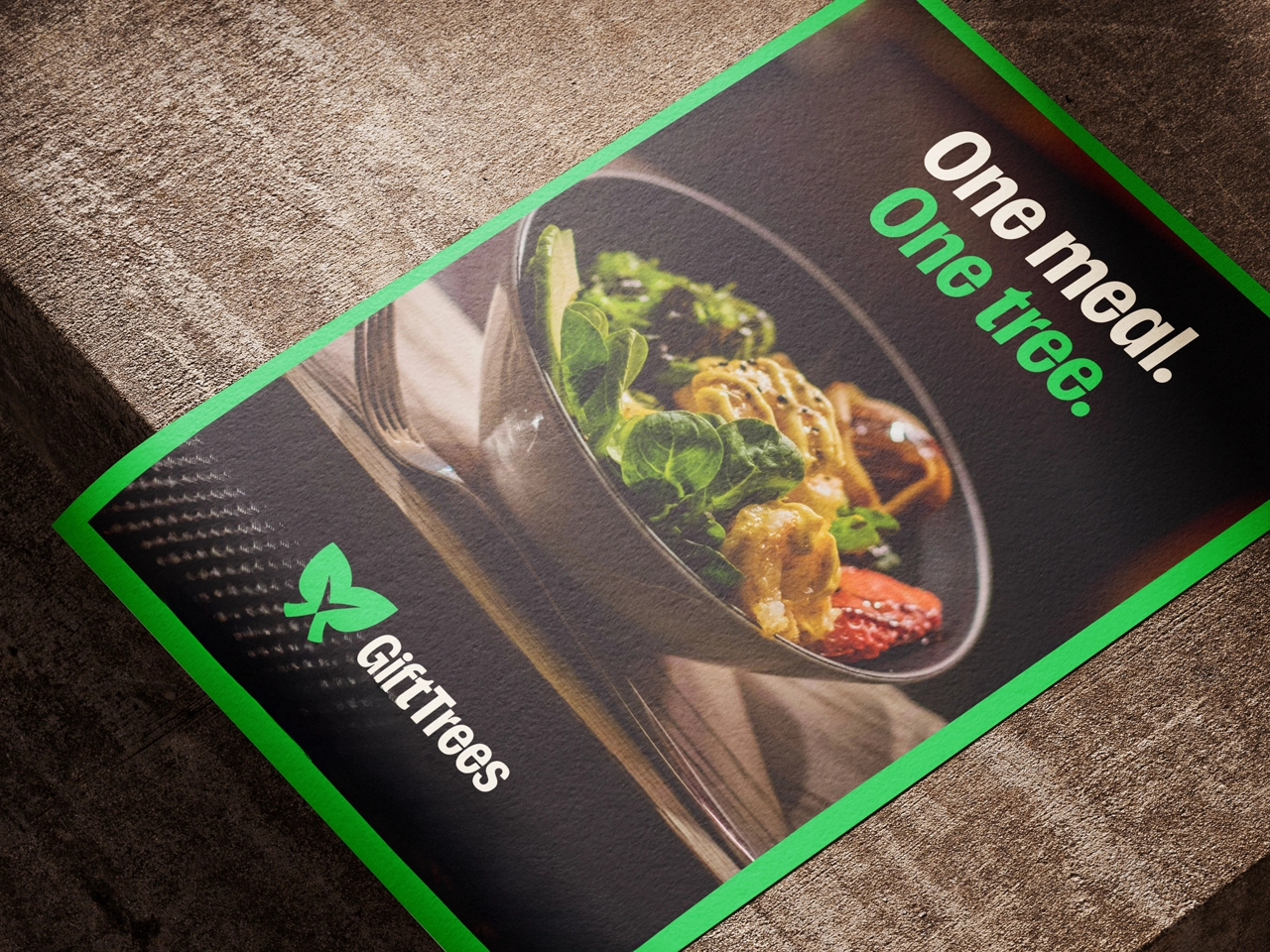 GiftTrees branded marketing material featuring a plate of food with vegetables and protein, with green accent branding and "one meal, one tree" tagline