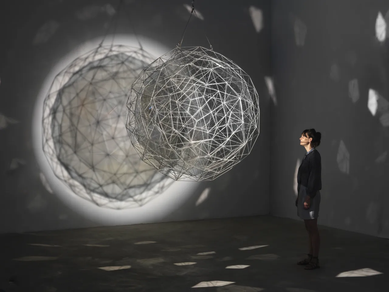 Stardust particle, 2014  Stainless steel, translucent mirror-filter glass, wire, motor, spotlight Ø 1760 mm  Tate  Photo: Jens Ziehe, 2017  © 2014 Olafur Eliasson