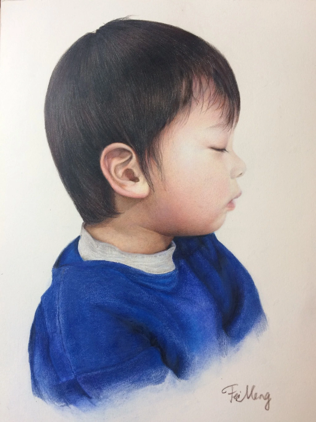 Portrait of a Chinese boy with his eyes closed