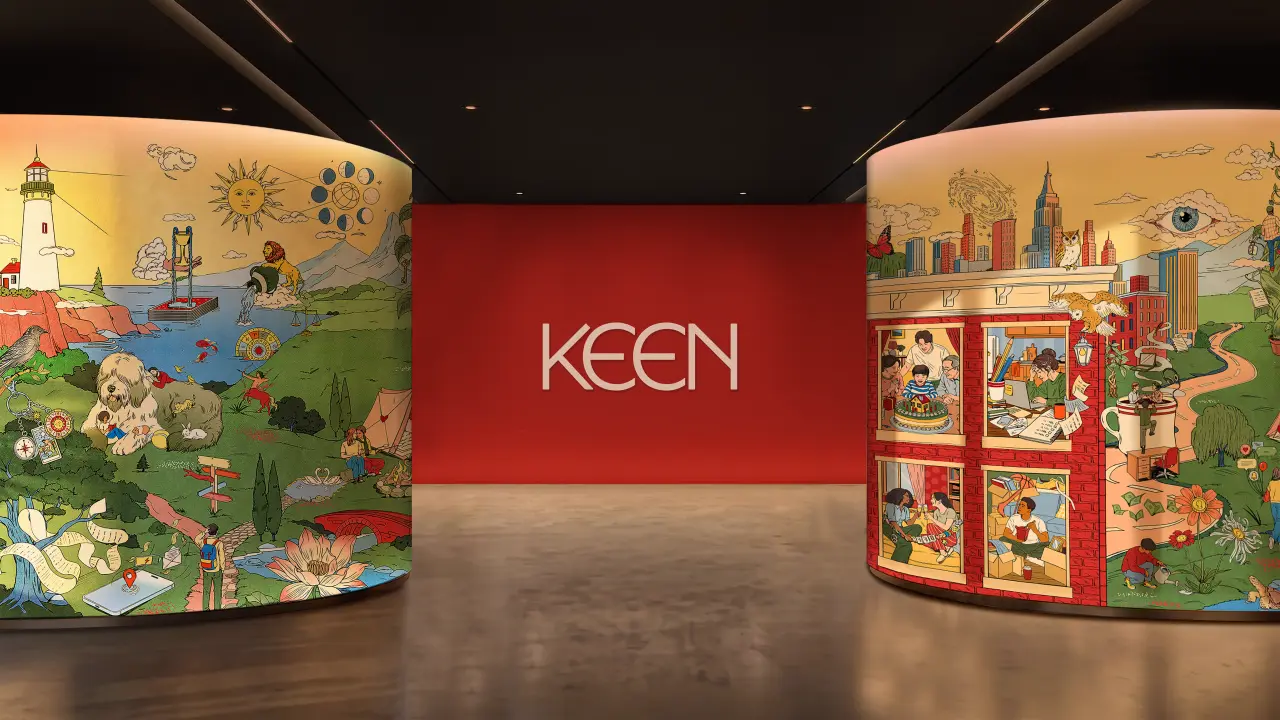 Keen's rebranding exhibition space with illustrated panels depicting pastoral landscapes and city scenes flanking a central red wall with the Keen logo