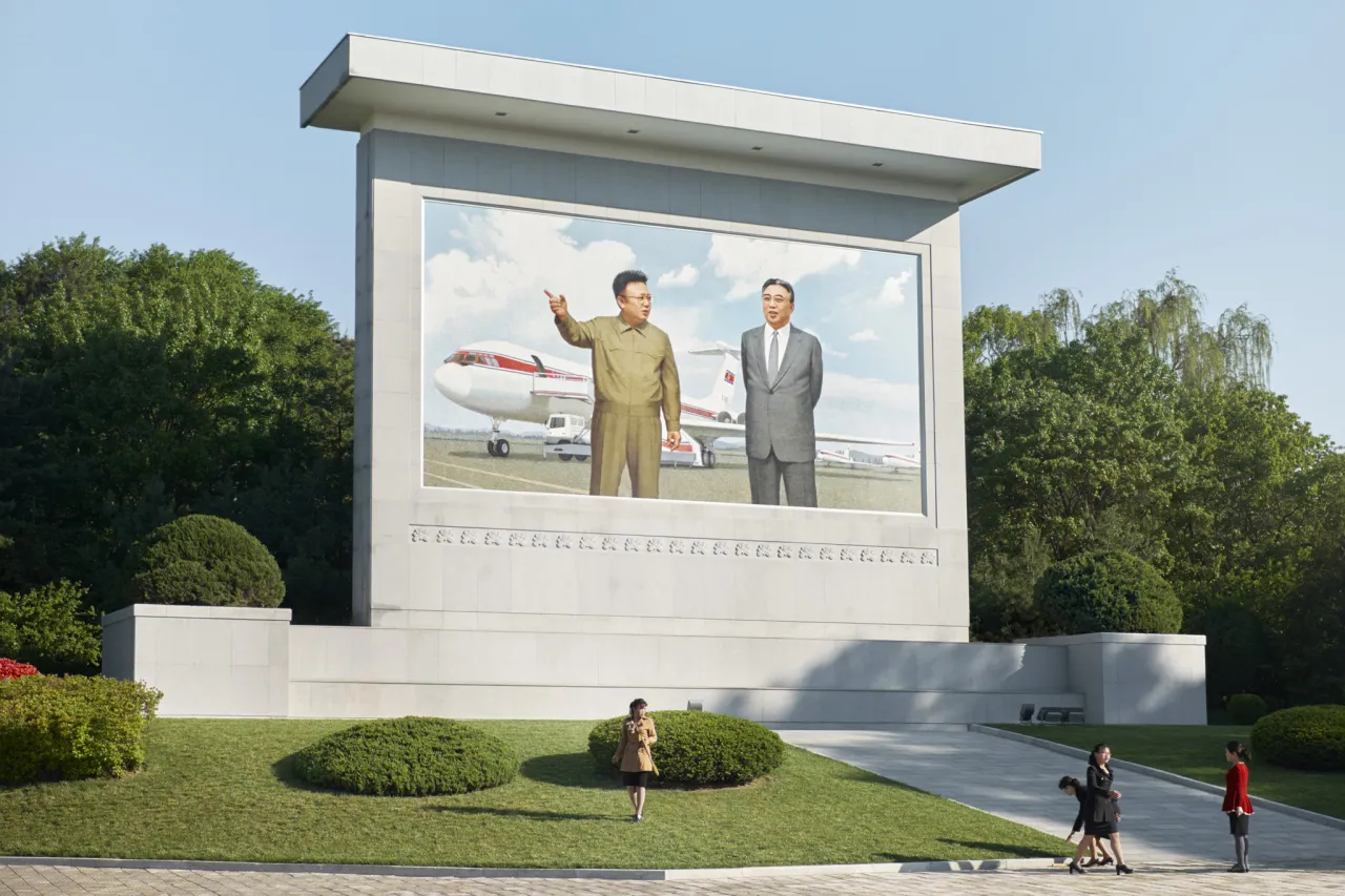 A Mosaic monument near Sunan airport featuring the former leaders of North Korea standing before an Ilyushin-62 and a Tupolev-154