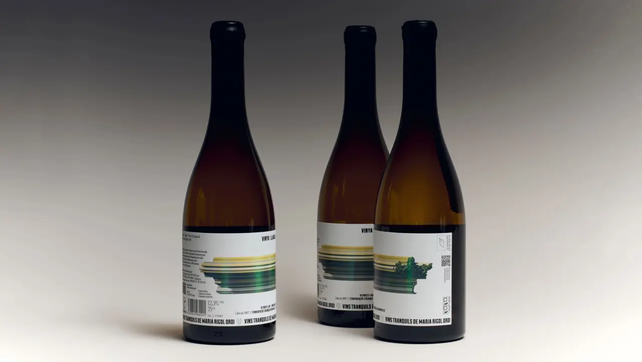 Three bottles of Vinya Llarga wine featuring labels with horizontal streaks of yellow, green and blue that evoke motion, like a photograph taken from a speeding train