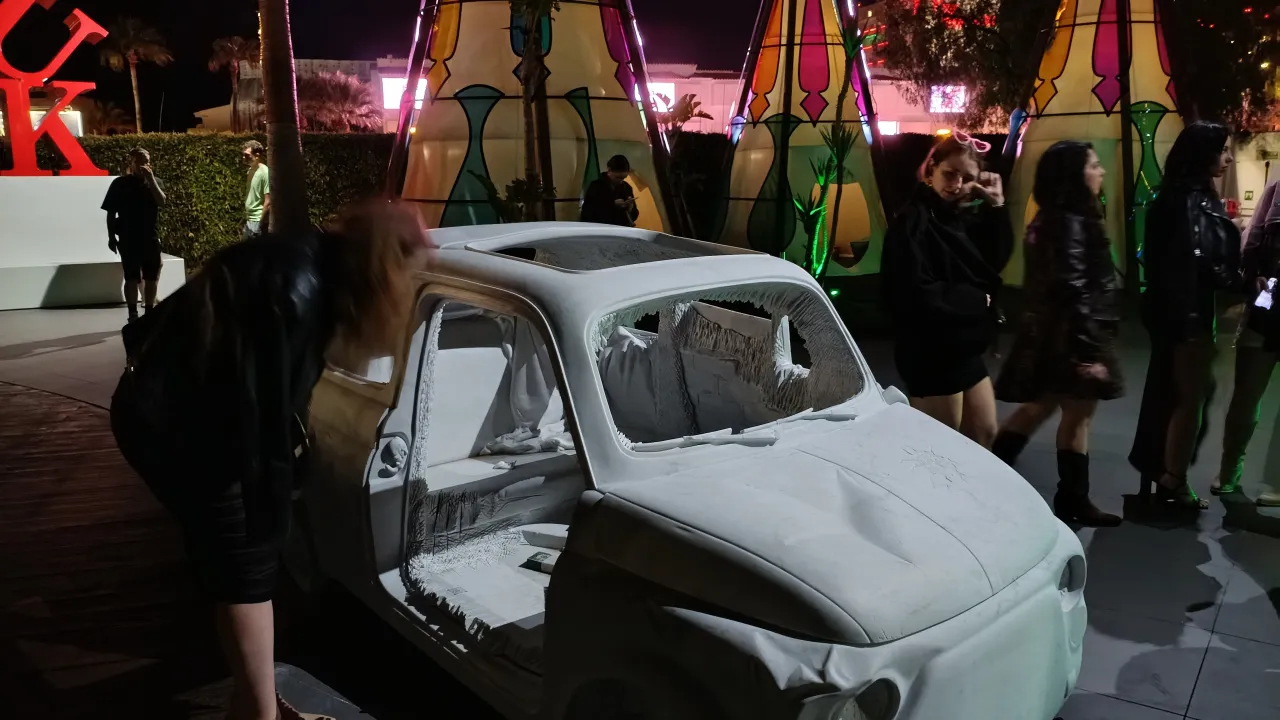 Clubber examining the Fiat 500 sculpture