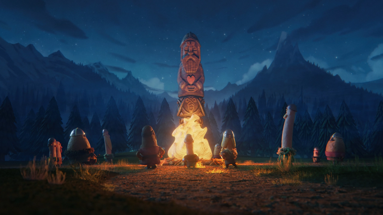 Jordic the Viking character stands on a tall wooden totem pole glowing with firelight, surrounded by his Viking companions gathered around a campfire in a moonlit forest clearing.
