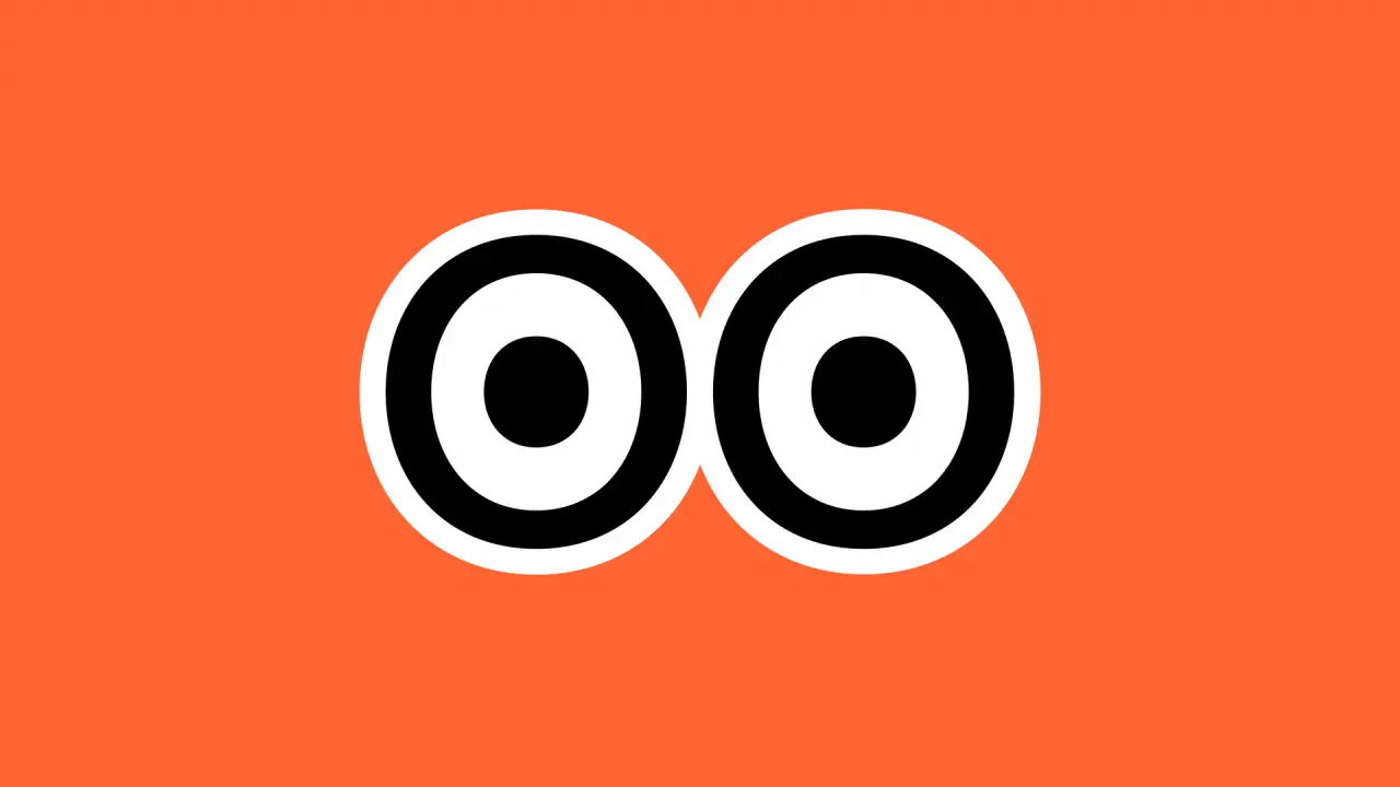 Creative Boom's mascot eyes with concentric black and white circles and black pupils on a bright orange background