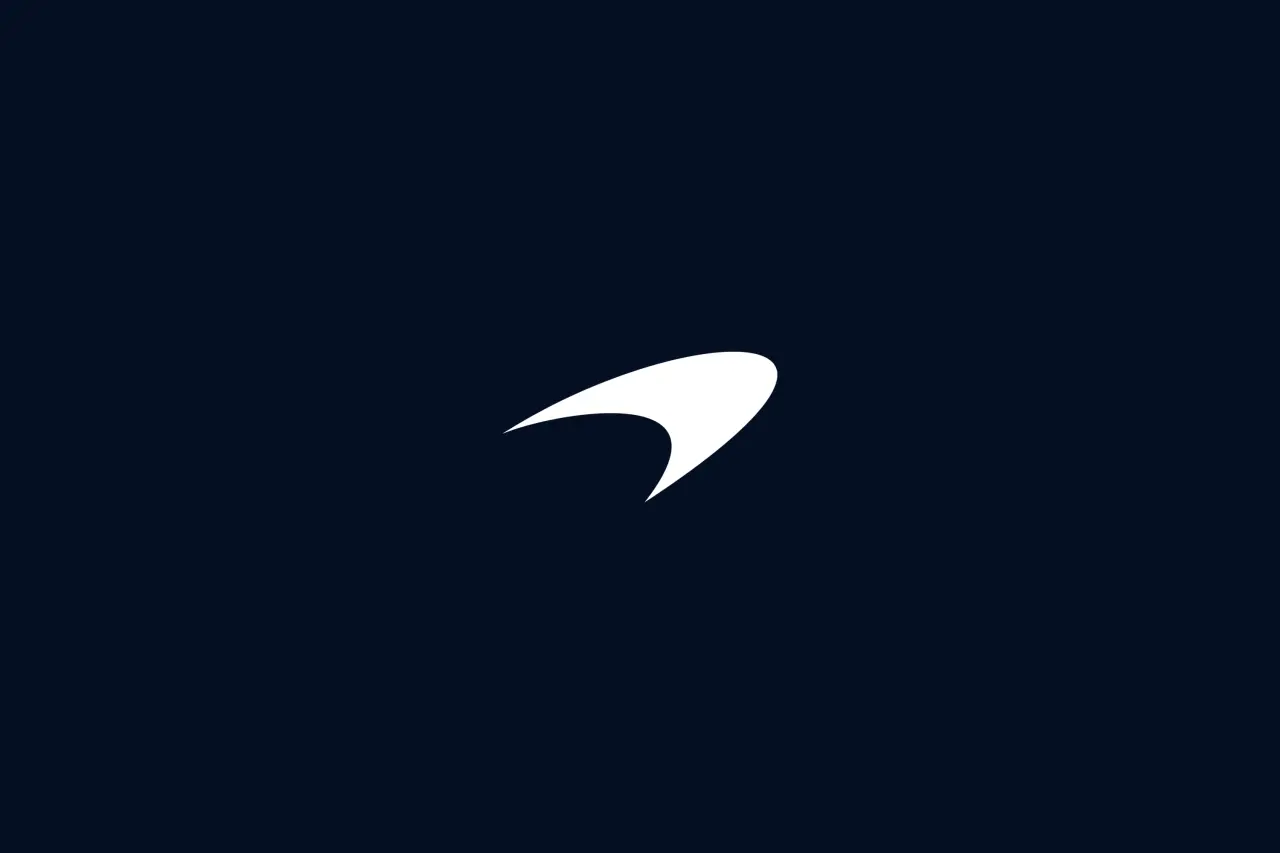 McLaren's white Speedmark symbol on a dark blue background
