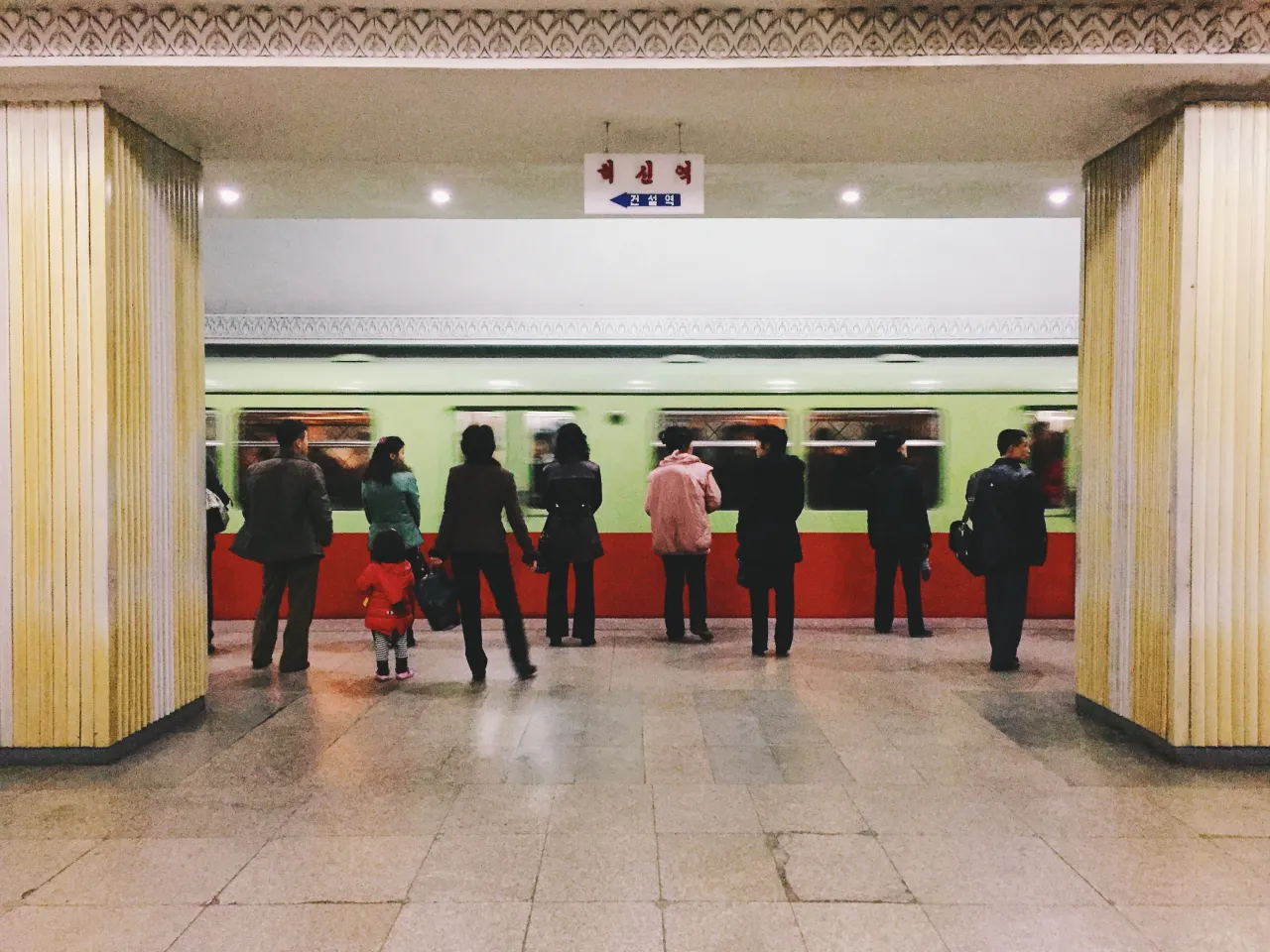 Folks lined up for the next subway train.