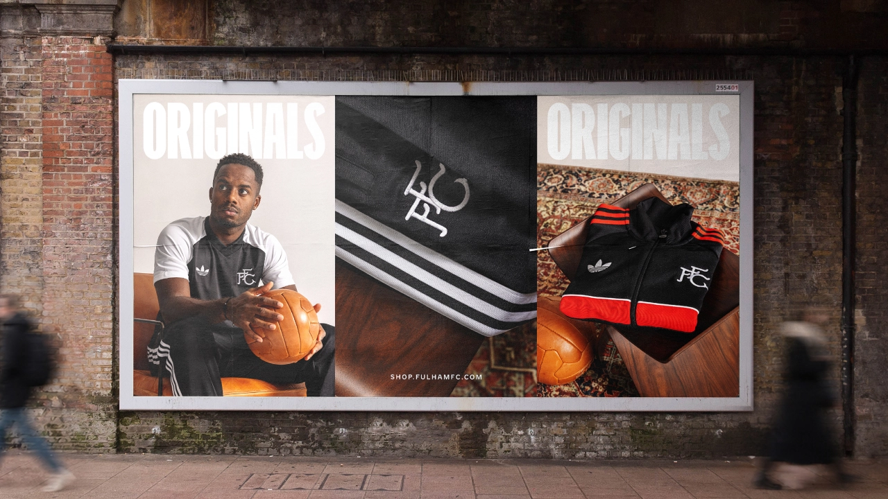 Large billboard displaying Fulham FC's new identity with a player holding a basketball on the left, the club's bespoke typeface in the centre, and branded sportswear on the right
