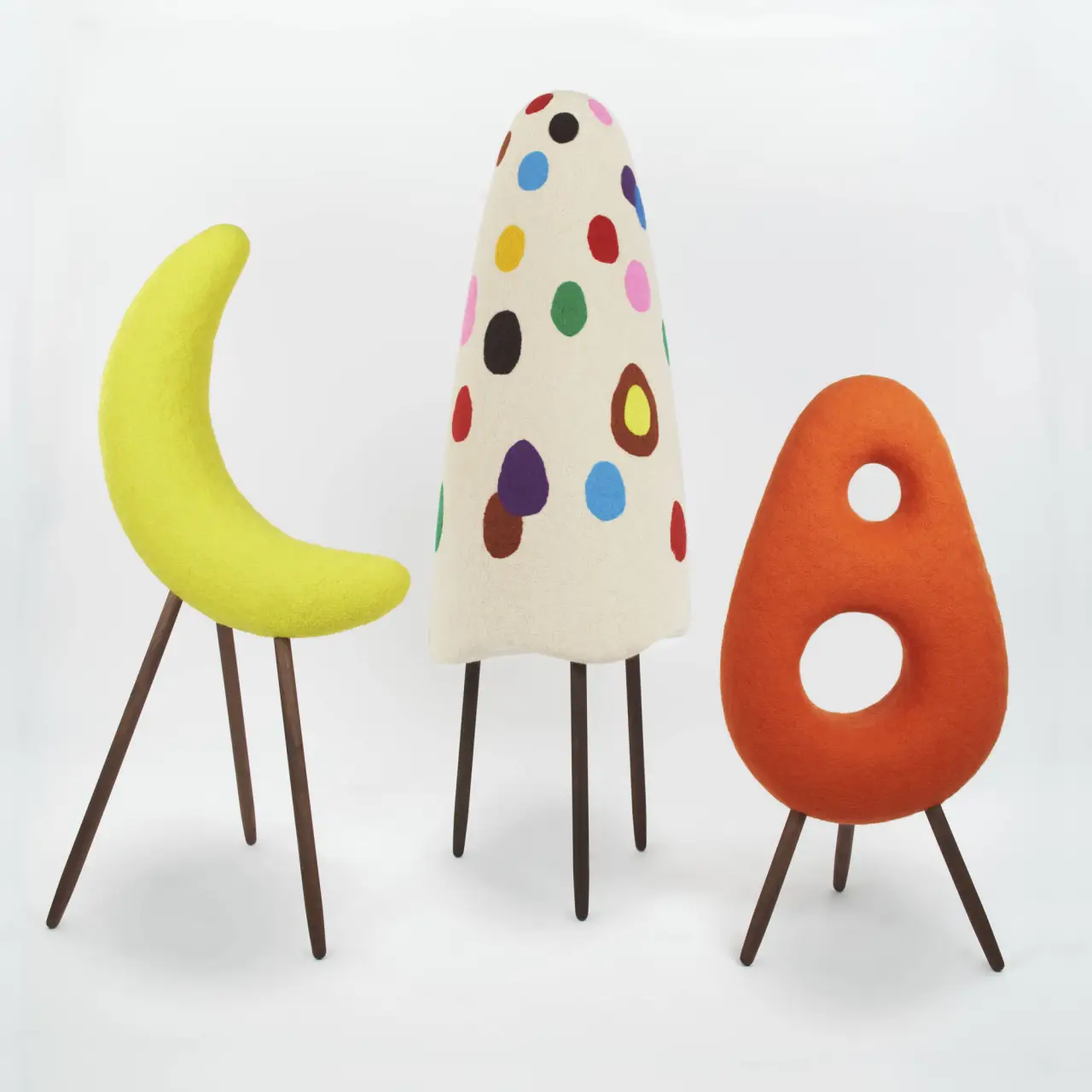Mikazuki Yokai (animated crescent moon), 2021 [left] Wool on EPS form, walnut wood (H) 59 inches x (W) 31 inches x (D) 26 inches  Ittan momen (animated roll of cotton), 2021 [middle] Wool on EPS form, wenge wood (H) 72 inches x (D) 24 inches  Gobo Obake (possessed burdock roots ghost), 2021 [right] Wool on EPS form, walnut wood (H) 47 inches x (W) 23 inches x (D)17 inches Courtesy of Artist
