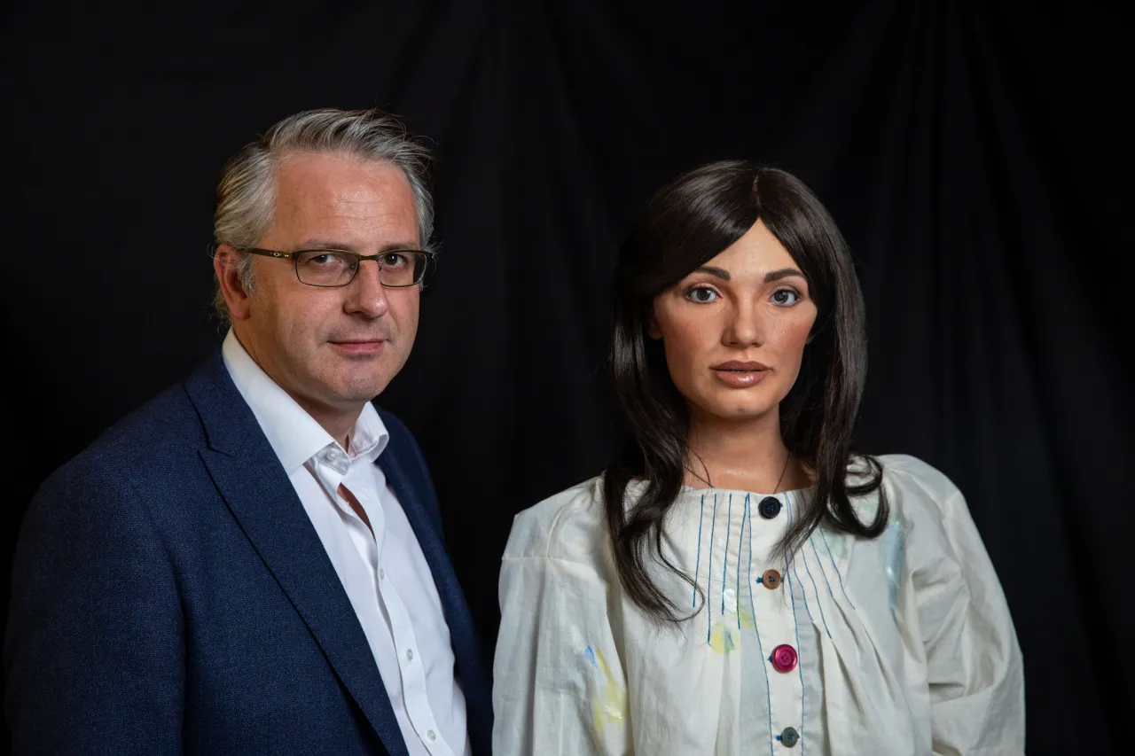 Ai-Da with her maker, Aidan Meller. Photography by Victor Frankowski