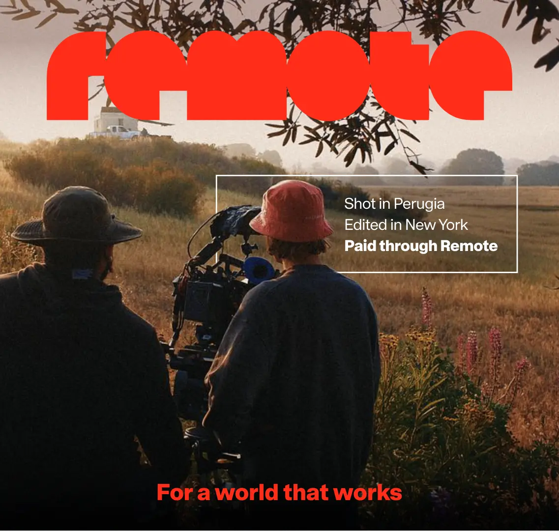 Two silhouetted figures operate a film camera in a rural field at golden hour, with "Paid through Remote" text overlay stating it was shot in Perugia and edited in New York
