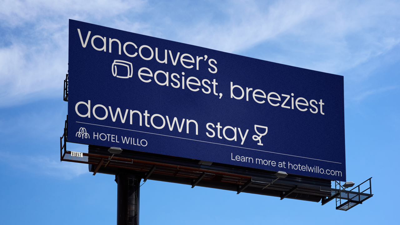 Hotel Willo billboard advertising Vancouver's easiest, breeziest downtown stay against a blue sky