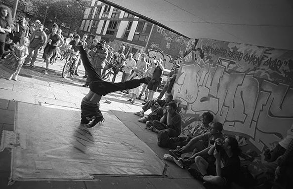 B.boy Evo dancing at the Smear II event, Hulme 1996 - Photograph by Al Baker