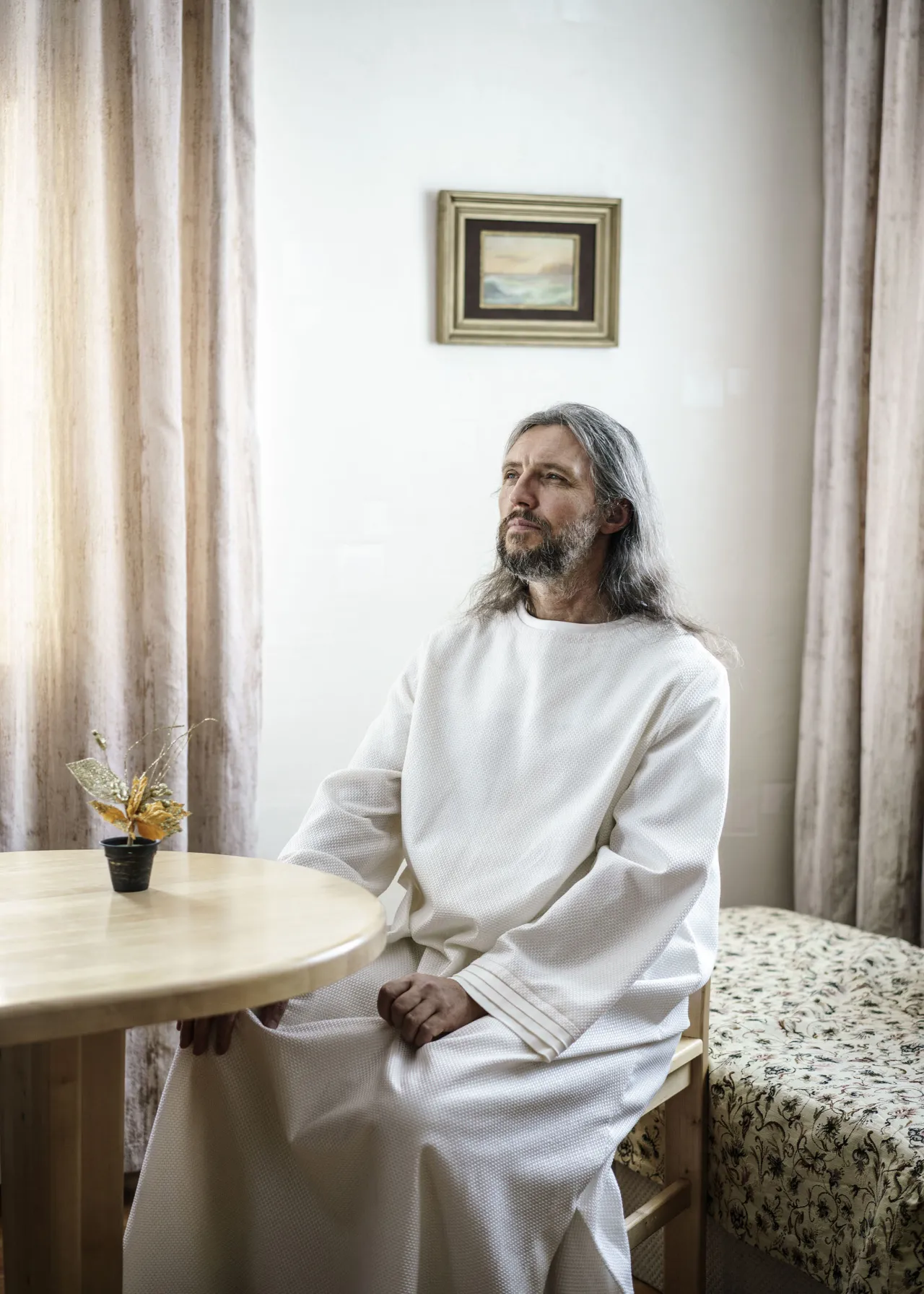 Vissarion, the Christ of Siberia. Formerly a traffic policeman in the 1980s, he got his first revelation that he was Jesus Christ at the same time as the breakup of the Soviet Union. Since then he has gathered a following of 5-10 000 disciples in the Siberian forest. There they live in separate villages with their own infrastructure and social systems. Russia, 2016 | © Jonas Bendiksen/ Magnum Photos