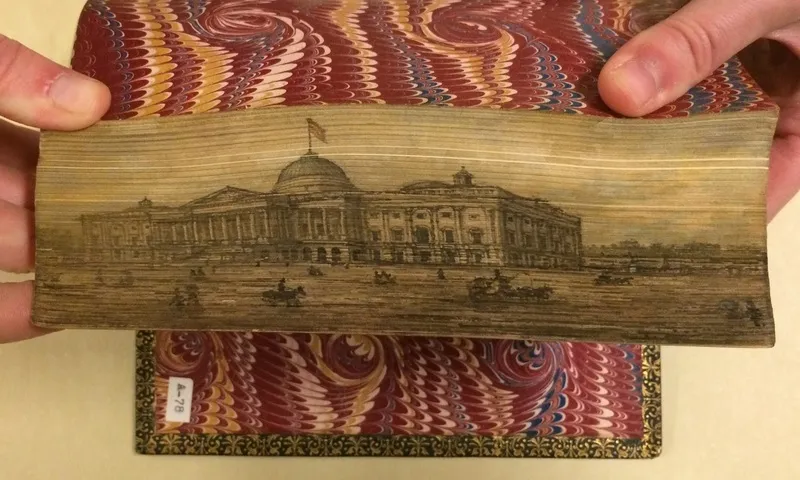 The American capital painted on the edge of American Poems (1870) | Photo courtesy of [The Swem Library](https://libraries.wm.edu/research/special-collections/books-periodicals/ralph-h-wark-collection)