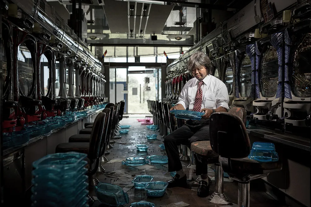 Yasushi Ishizuka at a Japanese games arcade in Tomioka