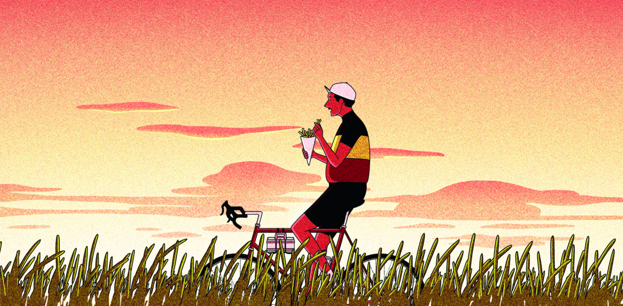 Person on red bicycle riding through grassland against a warm sunset sky, holding binoculars and looking upwards