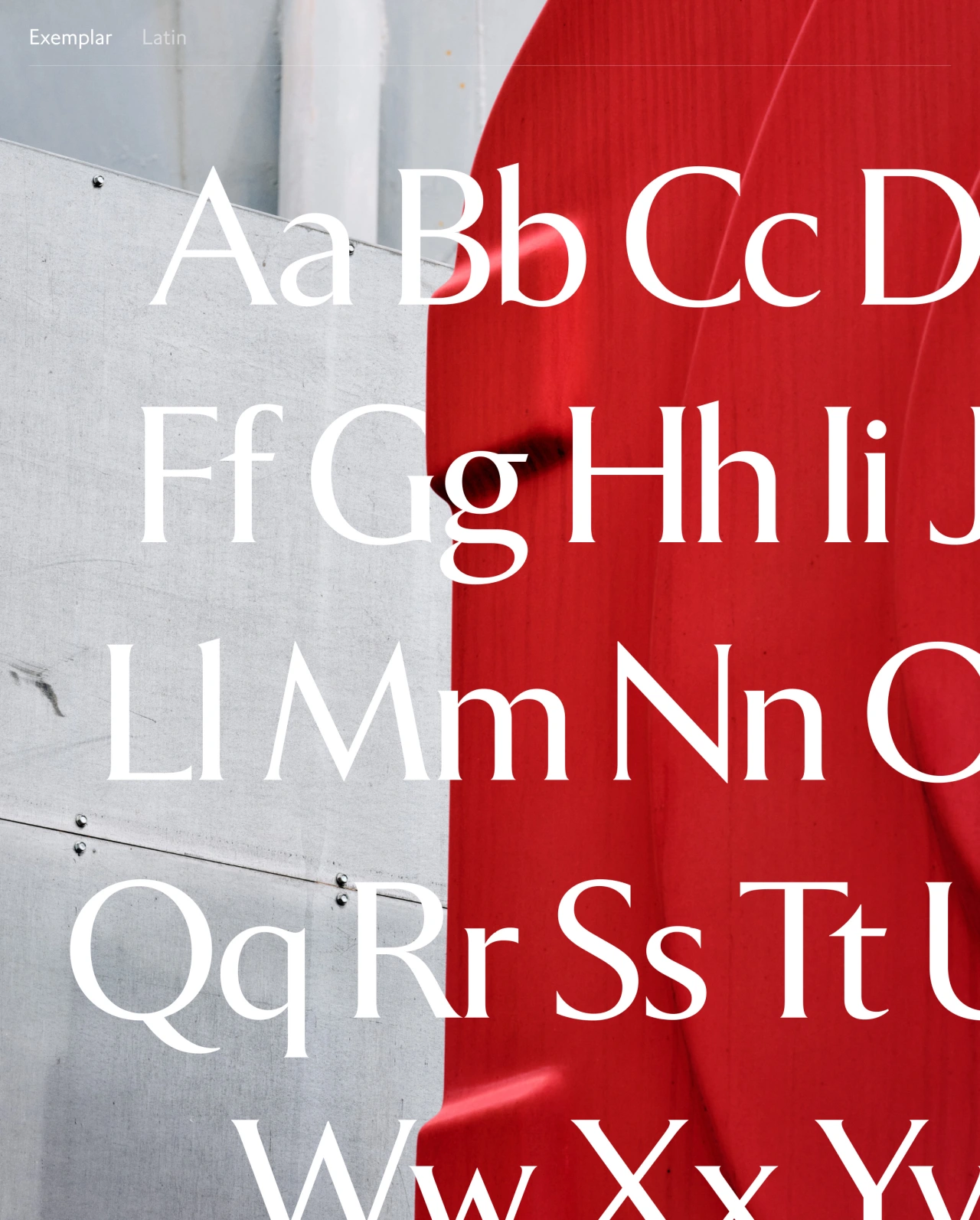 Exemplar Latin typeface showing uppercase and lowercase letters displayed across grey and red surfaces