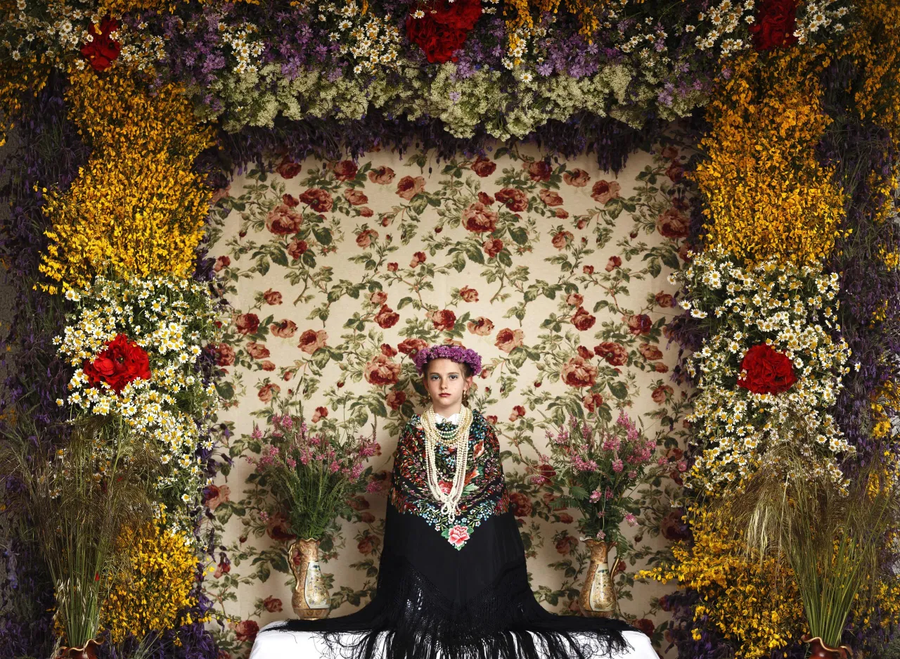 People, second prize stories: Young girls between the age of 7 and 11 are chosen every year as 'Maya' for the 'Las Mayas', a festival derived from pagan rites celebrating the arrival of spring, in the town of Colmenar Viejo, Spain. The girls are required to sit still for a couple of hours in a decorated altar. Daniel Ochoa de Olza.