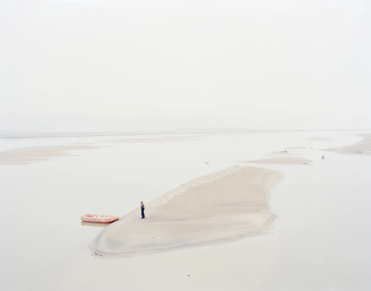 A man standing on an island in the middle of the river, Shaanxi, China, 2011 © Zhang Kechun