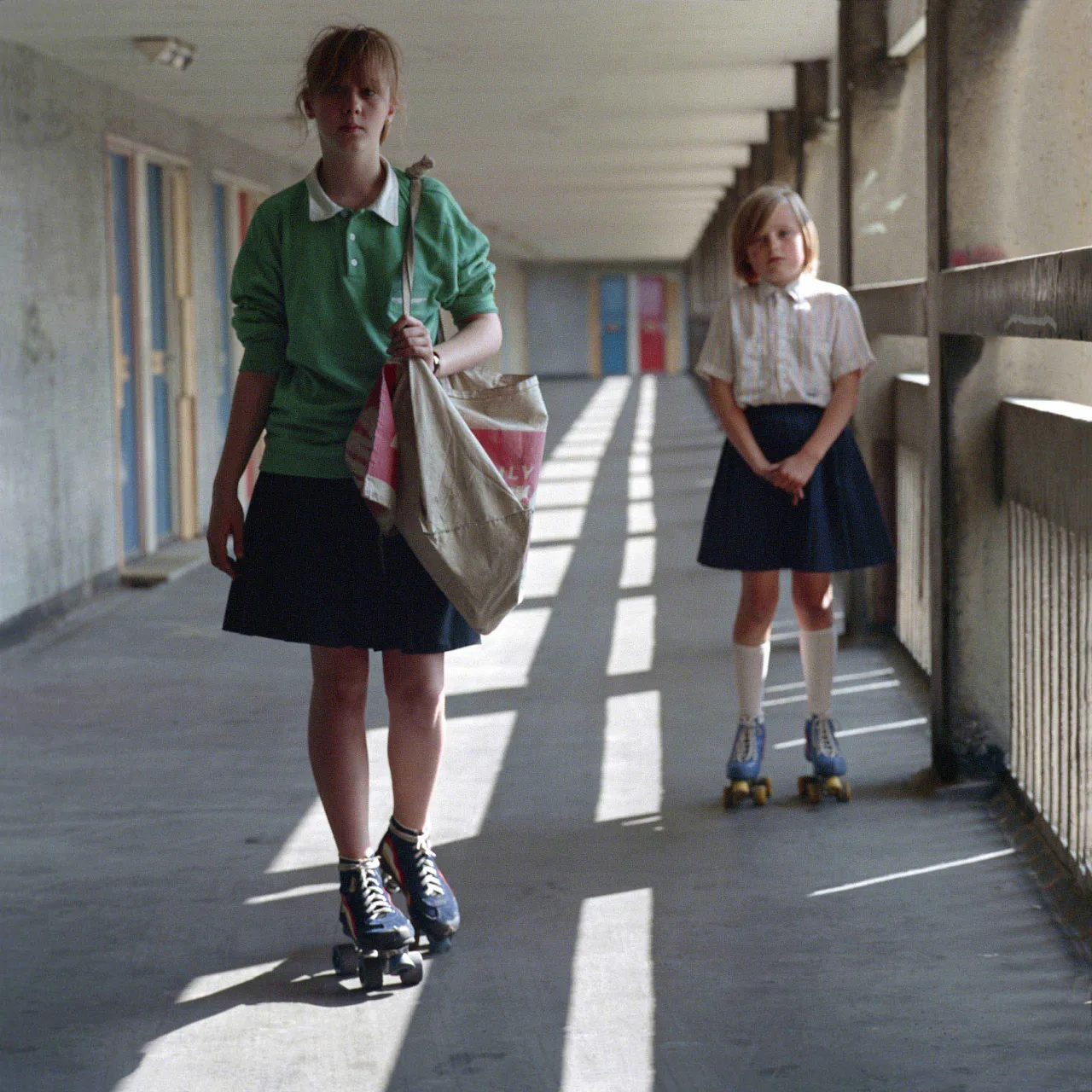 Bill Stephenson, Roller skating paper girls Anita and Emma. Hyde Park Flats, Sheffield, 1988 © Bill Stephenson