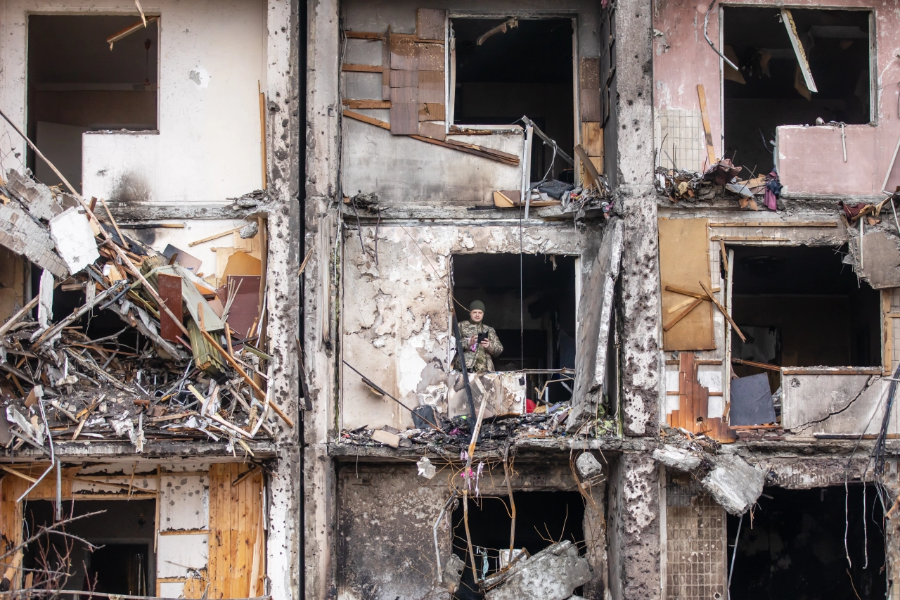 KYIV, UKRAINE - Feb. 25, 2022: War of Russia against Ukraine. View of a civilian building damaged following a Russian rocket attack the city of Kyiv, Ukraine  — Photo by palinchak