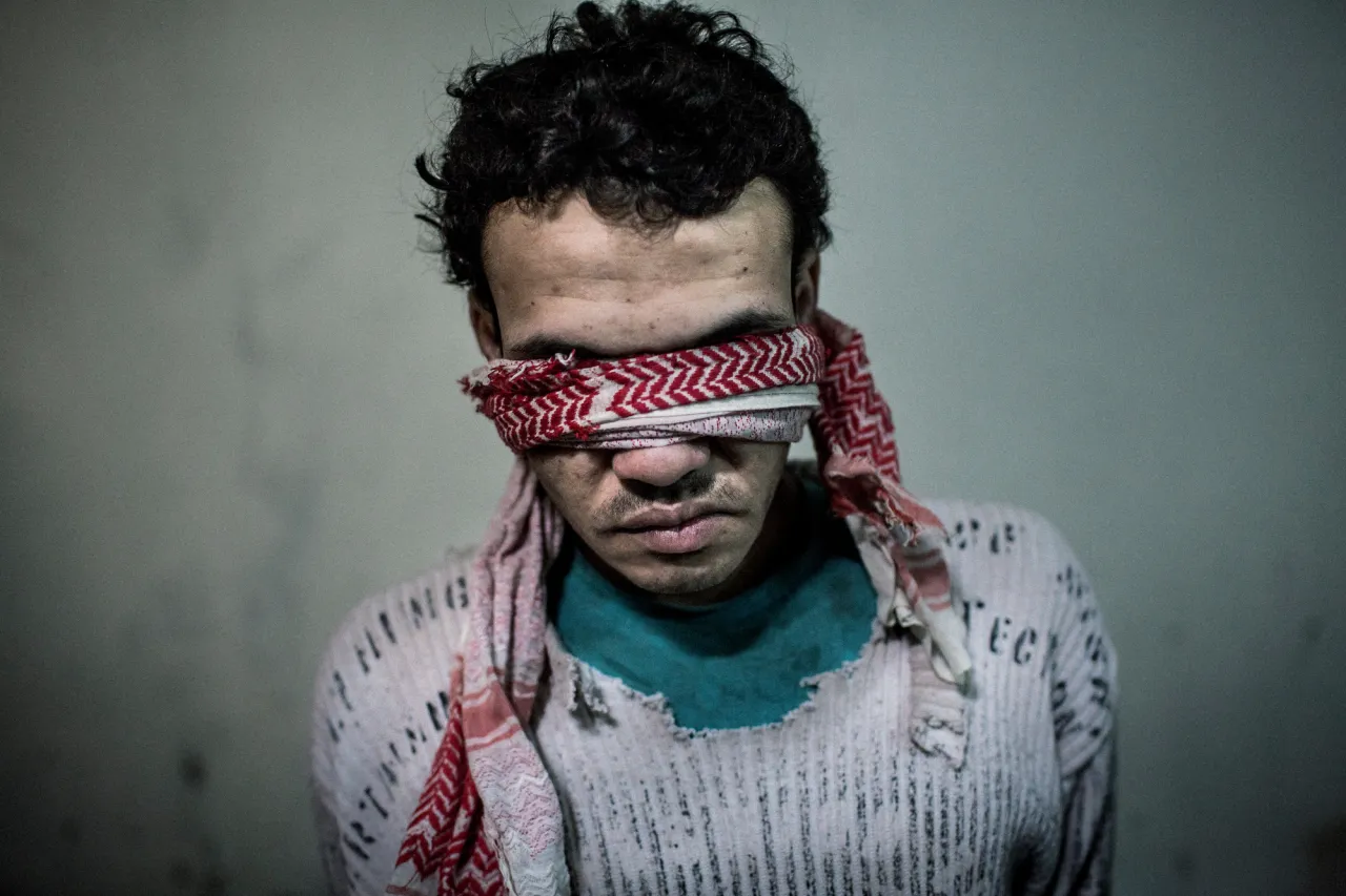 Ahmad, a young man in his early twenties, is a member of ISIS (The Islamic State in Iraq and Syria). In February 2015, Kurdish YPG militia arrested him after he was seen and revealed in their territory in the northeastern part of Syria. © Asger Ladefoged. Open Single Image Winner, Magnum and LensCulture Photography Awards 2016