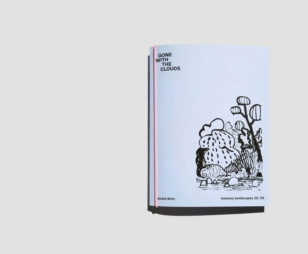 André Britz's book Gone with the Clouds lying open, showing the cover with title and an ink sketch of rain falling on plants and flowers