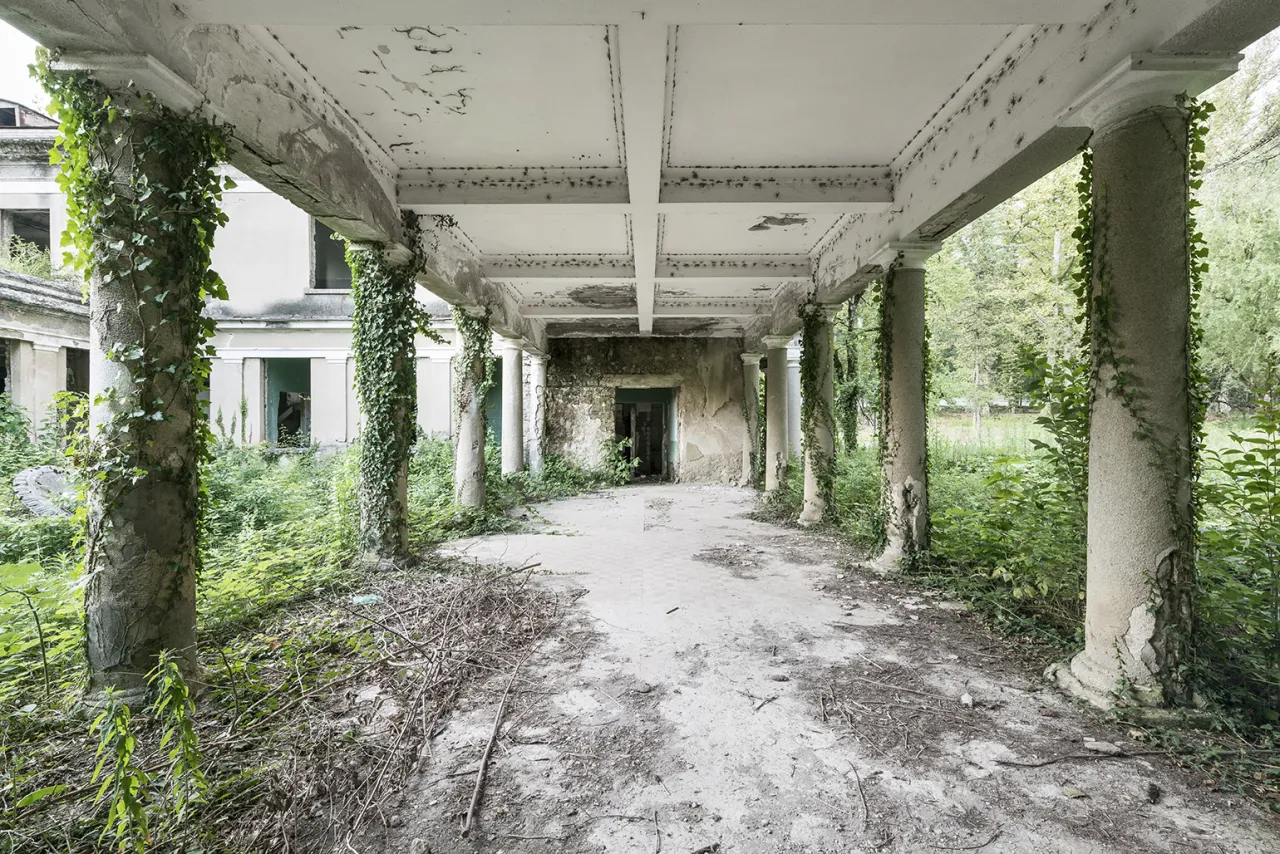 An exterior passage leads towards one of the many bathhouses, popular for its curative water treatments. Tskaltubo, Georgia. © Reginald Van de Velde