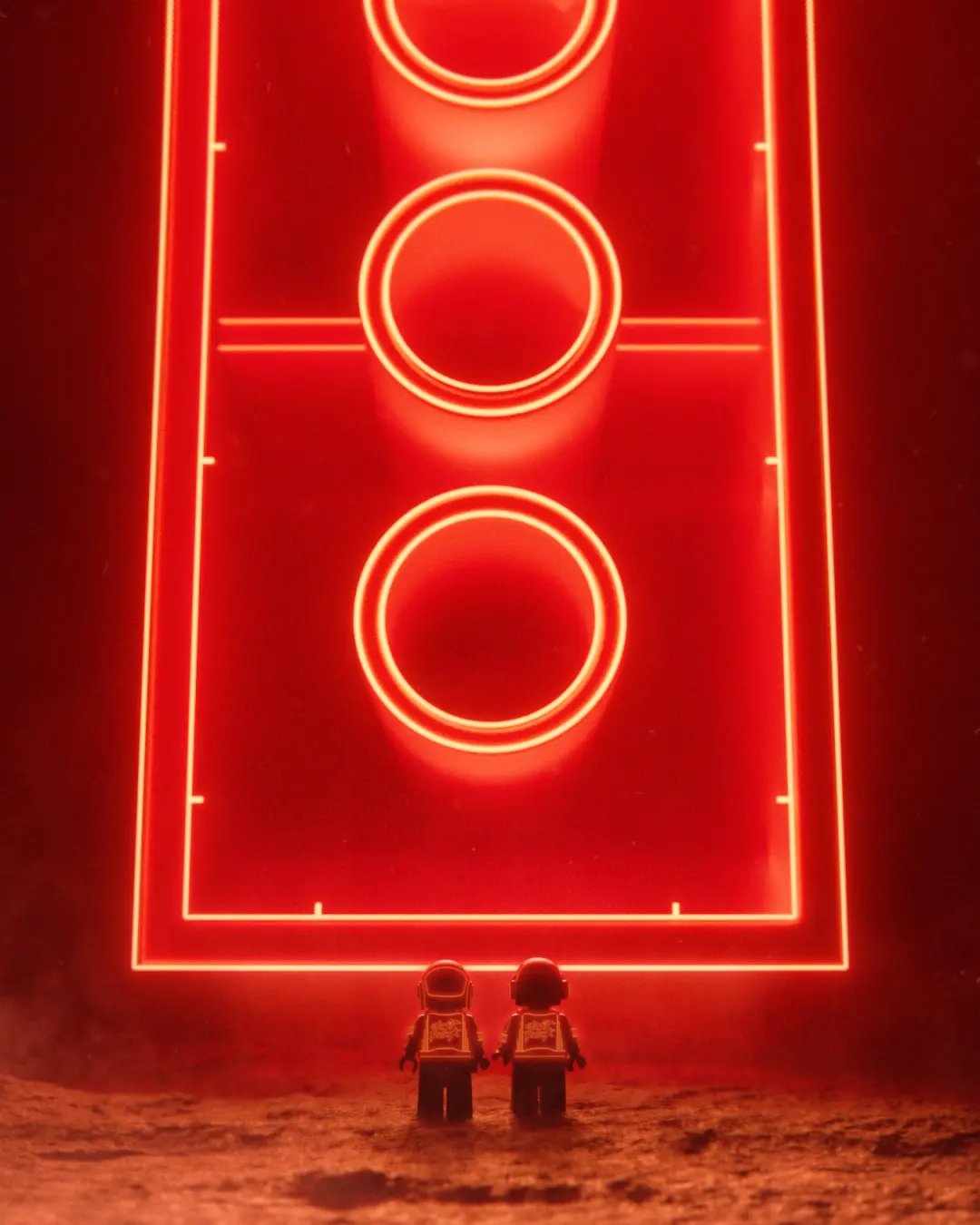 Two Lego astronauts stand on a red-dust landscape facing a massive glowing neon sign shaped like a football pitch with three illuminated circles