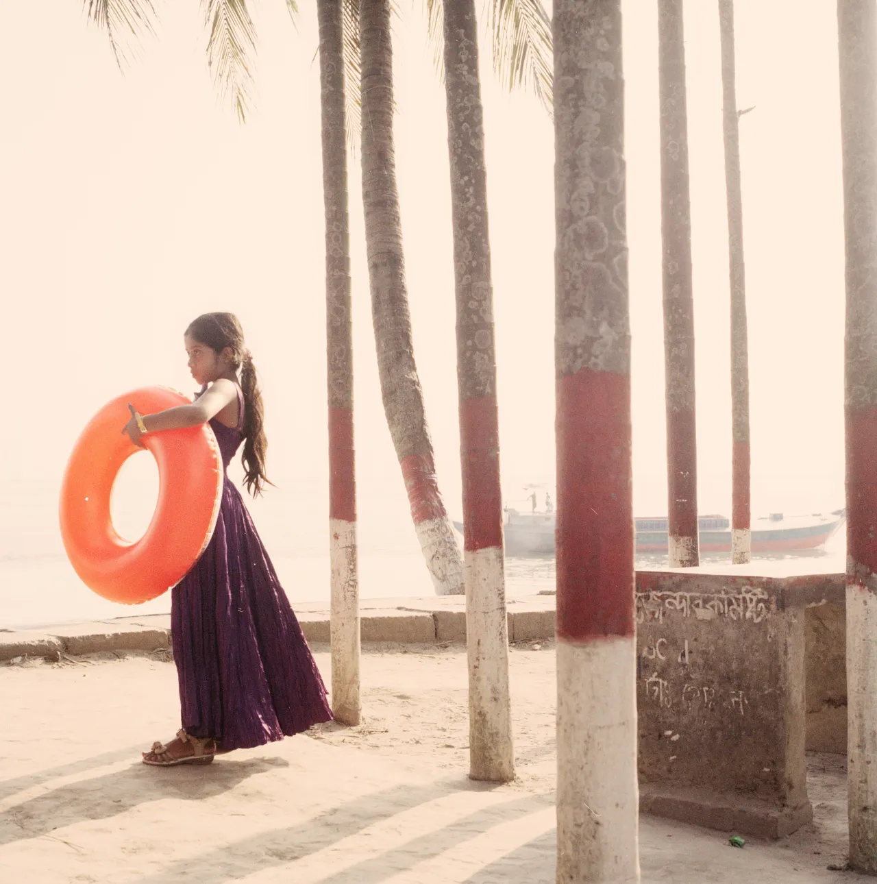 Young girl poses for a picture at the point of entrance to the Sunderbans in Bangladesh, 2014 © Giulio Di Sturco