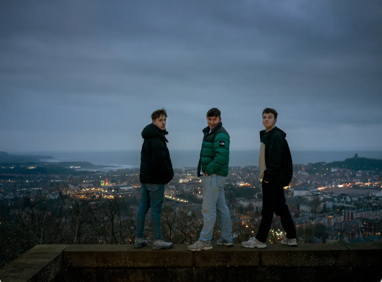 Charlie, 17, and Keane, 19, both from Eastfield, and Jack, 17, from Scarborough, pictured at Oliver's Mount, overlooking Scarborough. Keane wrote a play as a ‘love letter’ to his home town. Against the Tide, 2026. Photograph by Polly Braden