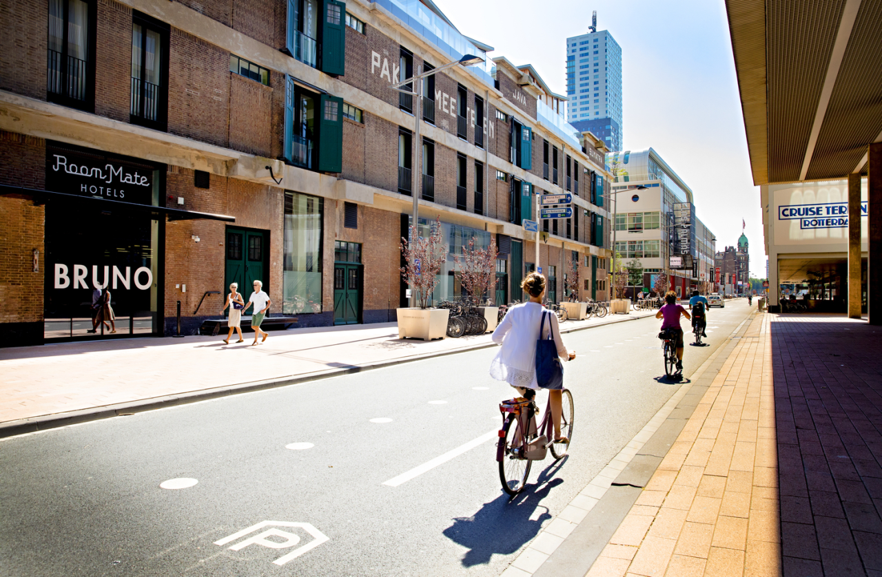 Cyclists ride past the Cruise Terminal. Photography by Iris van den Broek
