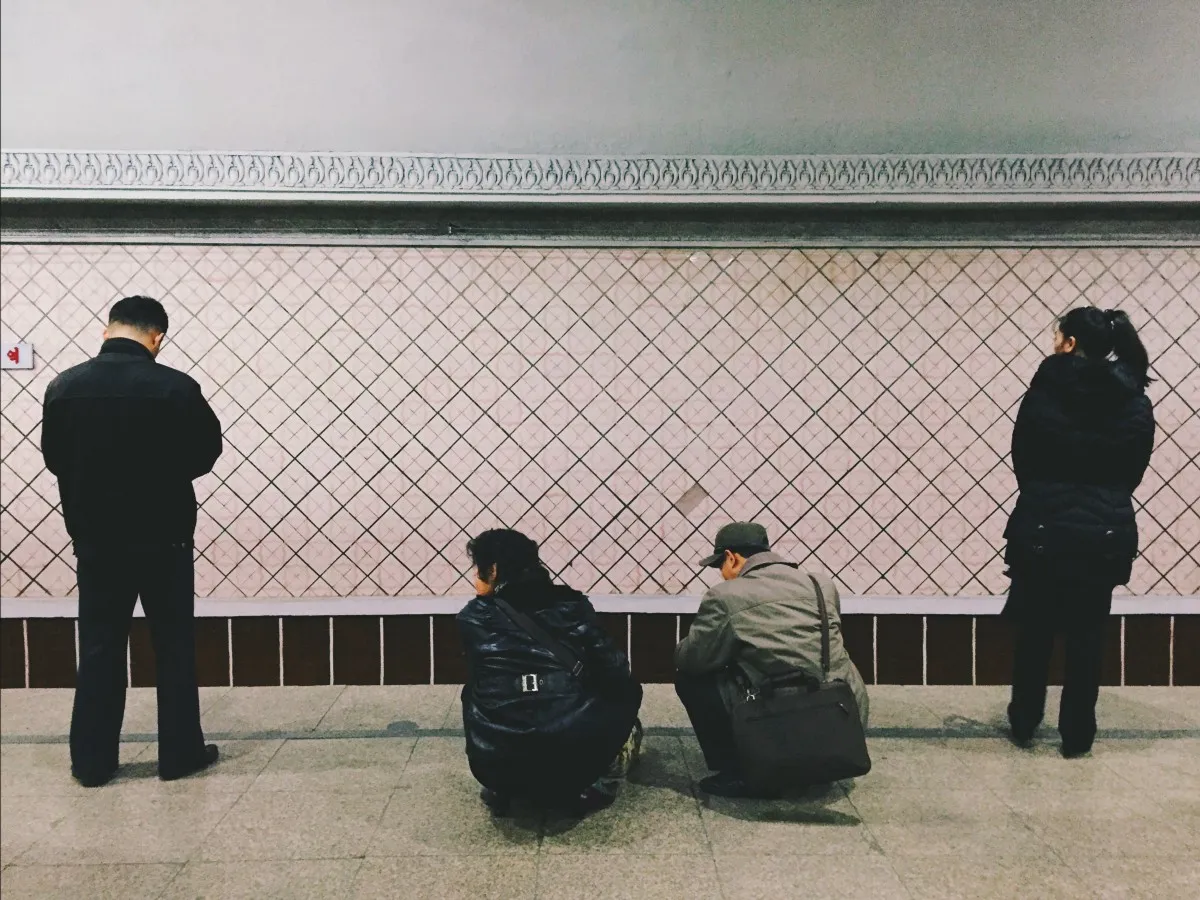 A very typical position that North Koreans took everywhere throughout the country.